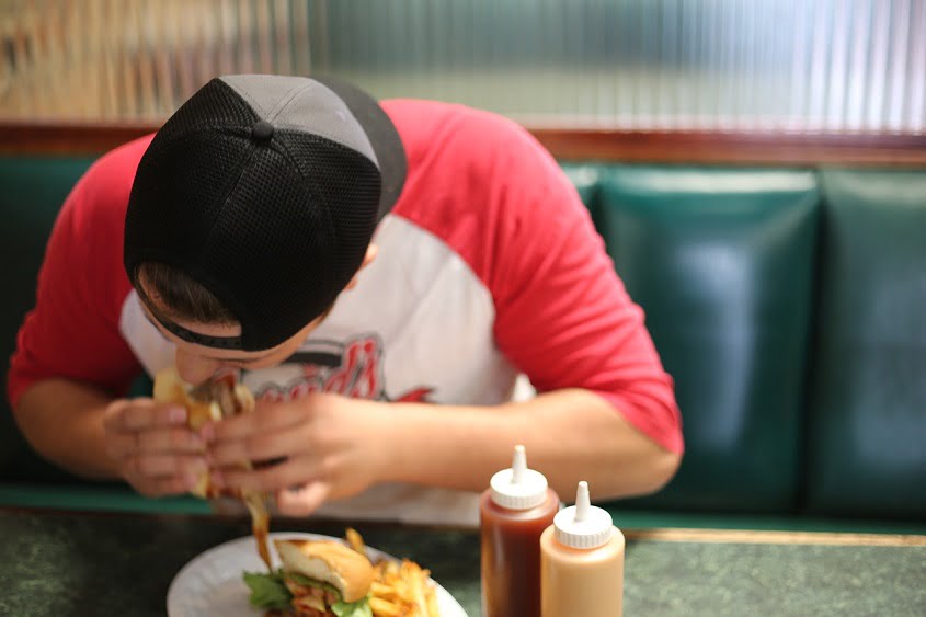 A man eating fast food