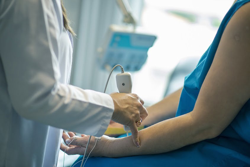 Doctor is using a medical equipment