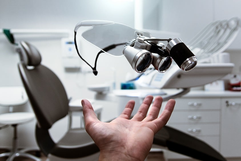 person showing magnifying eyeglasses
