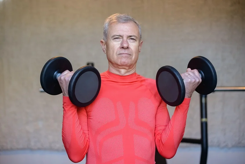 A 60-year-old person exercising as part of preventive care in their 60s