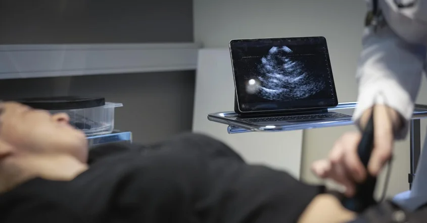 Medical professional performing an ultrasound on a female patient to diagnose and assess an ovarian cyst