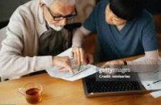 Older adult reviewing medical bills and healthcare expenses while planning finances