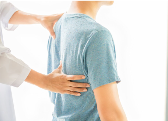 Chiropractor performing gentle upper cervical adjustment using QSM3 technique on patient with chronic neck pain.