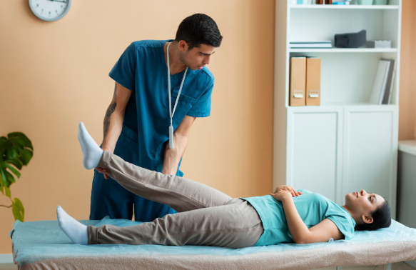 Patient performing guided physical therapy exercises with therapist in clinic to improve mobility and reduce pain.