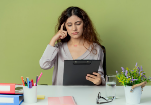 Adult patient sitting in dental clinic waiting room looking anxious before a dental appointment.