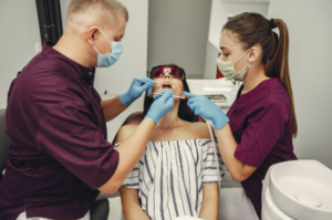 Patient experiencing severe tooth pain and consulting a dentist for urgent dental care.