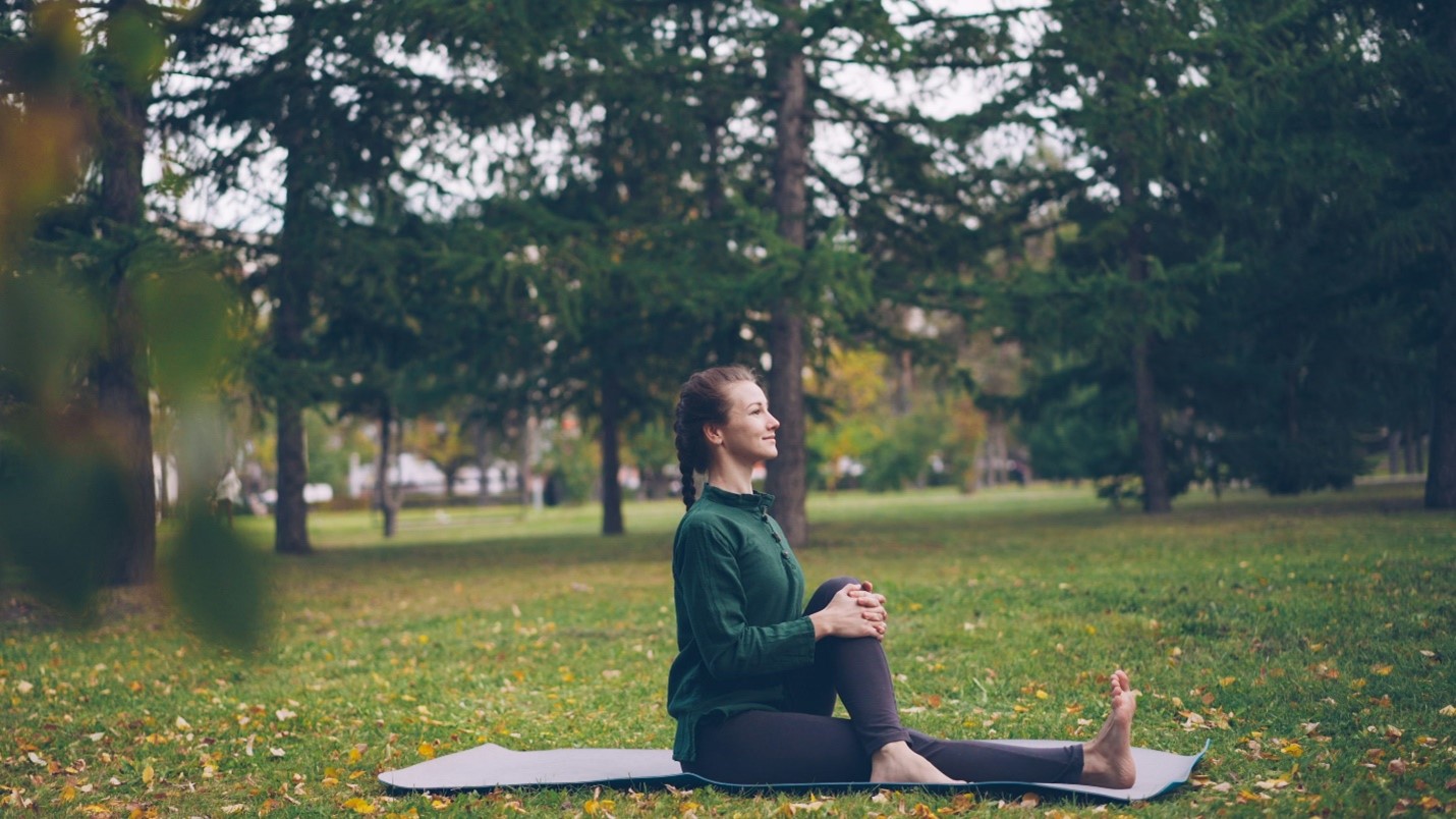 Person practicing healthy habits like exercise, balanced diet, and mindfulness to improve both mental and physical health.