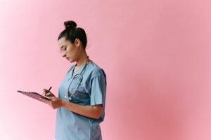 Switching to Nursing? The Essential Guide for Career Changers Adult student studying nursing books and preparing for a career change into healthcare as a registered nurse.
