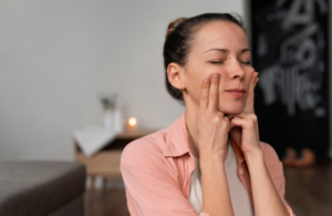 Woman applying sunscreen as part of an anti-aging skincare routine to protect skin from sun damage.