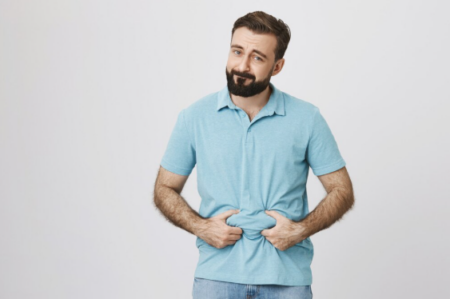 Patient measuring weight loss effects and emotional health during GLP-1 treatment consultation.