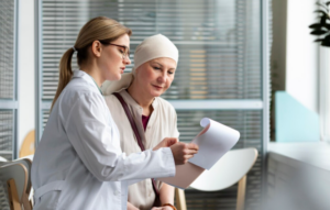 Doctor reviewing cancer scan results with a concerned patient after a delayed cancer diagnosis