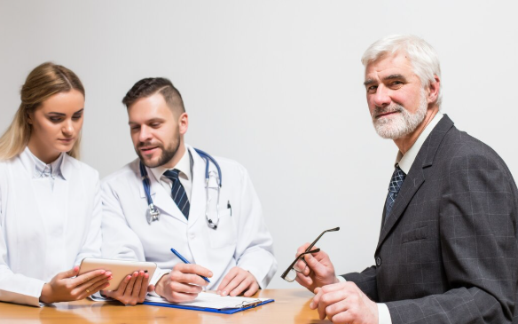 Medical malpractice attorney reviewing hospital records and legal documents related to a patient injury claim