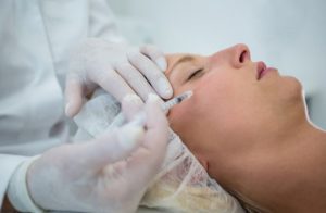 BOTOX in Charleston: Everything You Need to Know Before Your First Treatment Healthcare professional performing a cosmetic BOTOX treatment on a patient to reduce facial wrinkles and fine lines.
