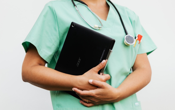 Nurse discussing a treatment plan in a modern healthcare setting