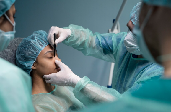 ENT surgeon reviewing nasal anatomy with a patient experiencing breathing difficulties after rhinoplasty.
