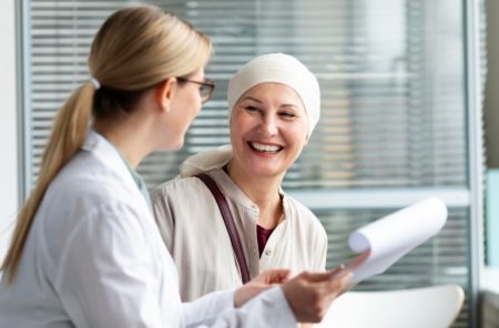 Plastic surgeon discussing breast reconstruction options with a woman during a consultation.