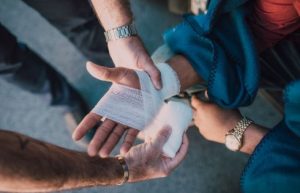 injured hand. applying bandage