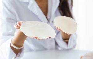 Considering Breast Augmentation? 4 Questions to Align Your Expectations with Reality a woman about breast augmentation surgery.