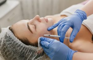 What Makes Dermal Fillers Look Natural Instead of Overfilled Cosmetic injector performing a dermal filler treatment to enhance facial volume with natural-looking results.