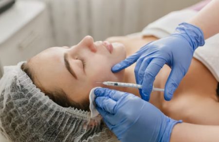 What Makes Dermal Fillers Look Natural Instead of Overfilled Cosmetic injector performing a dermal filler treatment to enhance facial volume with natural-looking results.