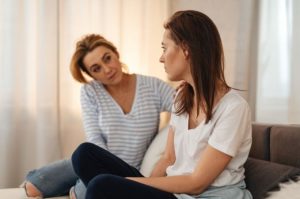 Healthcare professional speaking with an adult during a substance abuse treatment consultation