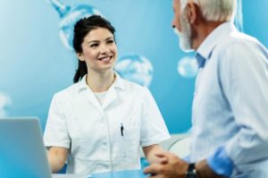 Concierge physician consulting with a patient in a private medical office while discussing a personalized healthcare plan.