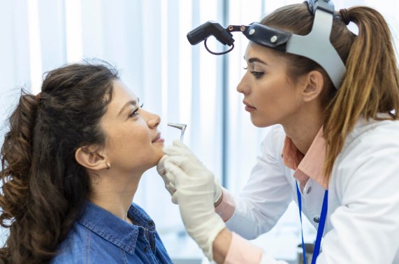 6 Signs You May Actually Need Nose Surgery to Fix Breathing Problems ENT surgeon evaluating a patient with chronic nasal obstruction during a nose surgery consultation.