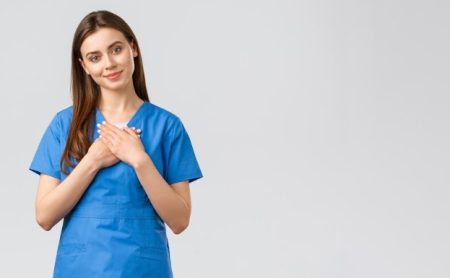 Nursing student studying online while preparing for clinical training at home.