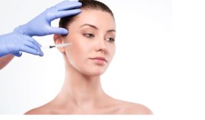 Aesthetic provider administering preventative Botox injections to a young adult during a cosmetic consultation.