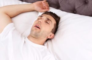 sleep apnea treatment options with a patient while reviewing sleep study results