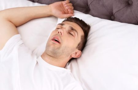 sleep apnea treatment options with a patient while reviewing sleep study results