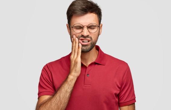 patient's teeth and gums during a routine oral health checkup.
