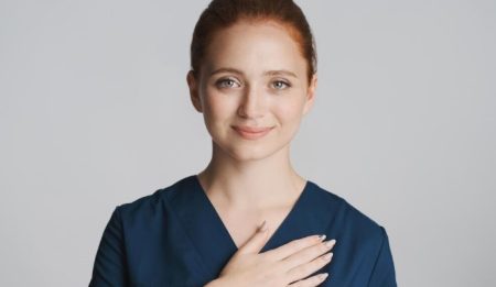 Breast Augmentation Recovery Tips for a More Comfortable Healing Process Woman during breast augmentation recovery while following post-operative care instructions at home.