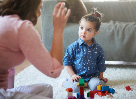 How Does ABA Therapy Help Build Positive Skills in Children with Autism? Child with autism practicing communication and daily living skills during an ABA therapy session.