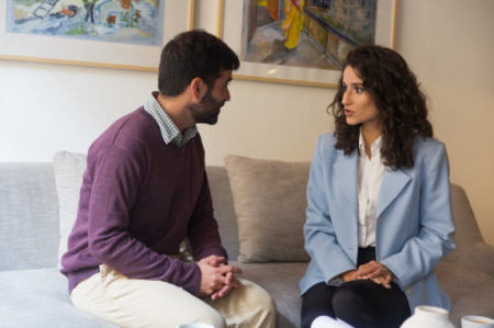 herapist speaking with a client during a trauma counseling session.