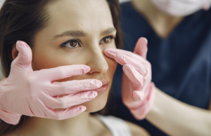Thin eyelid skin being evaluated during a blepharoplasty consultation.