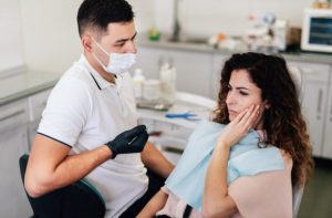 Patient speaking with a dentist about dental anxiety and ways to feel more comfortable during treatment.