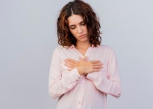 Why More Women Are Choosing Breast Lifts Without Increasing Cup Size Woman going through a breast lift without implants by a plastic surgeon during a cosmetic surgery consultation.