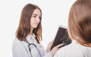 Beyond Credentials: What Really Matters When Choosing a Facelift Surgeon? Woman consulting with a plastic surgeon about facelift options and expected results.