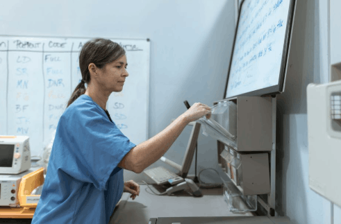 Nurse-practitioner-student sitting at her work