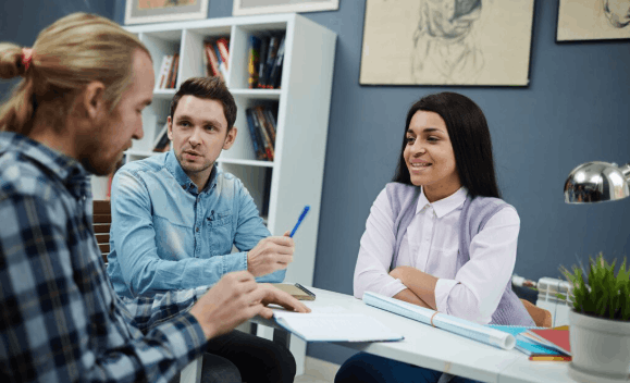 Patient discussing health history and treatment options with a naturopathic doctor during a first appointment.