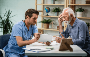 Injured at Work and Still in Pain? How Workers’ Compensation Care Can Help Injured worker discussing treatment and recovery with a healthcare provider.