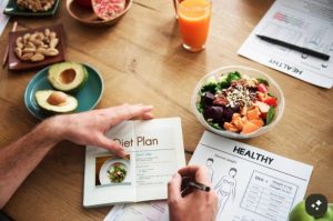 Balanced healthy meal featuring vegetables, whole grains, legumes, healthy fats, and lean protein