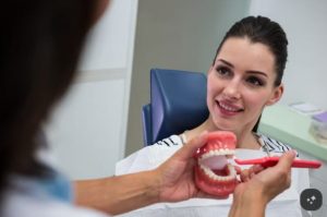 Common Dental Restoration Options for Improving Oral Health Dentist explaining dental restoration options to a patient
