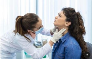 Top Functional Medicine Providers for Thyroid Health Healthcare practitioner discussing thyroid test results and personalized treatment options with a patient
