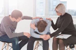 Mental health professional speaking with a patient during an outpatient therapy session