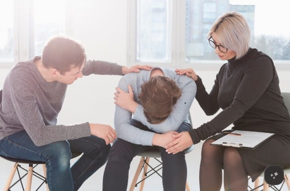 Mental health professional speaking with a patient during an outpatient therapy session