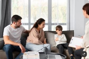 Parent speaking with an ABA therapist about a child's individualized therapy plan
