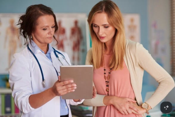 Surgeon consulting a patient about breast reduction surgery