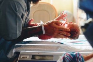 Birth Injuries And Their Potential Long-Term Effects Mother holding newborn after childbirth